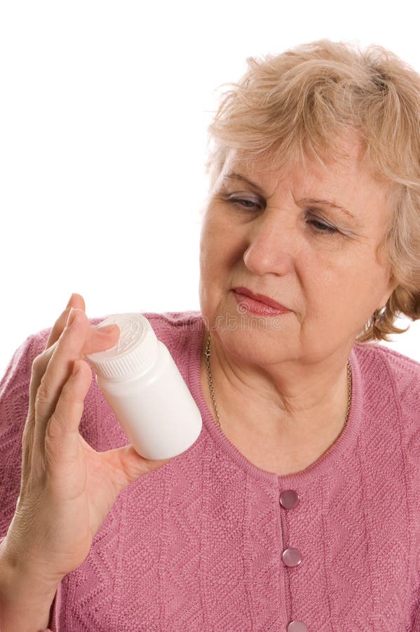 The elderly woman with tablets