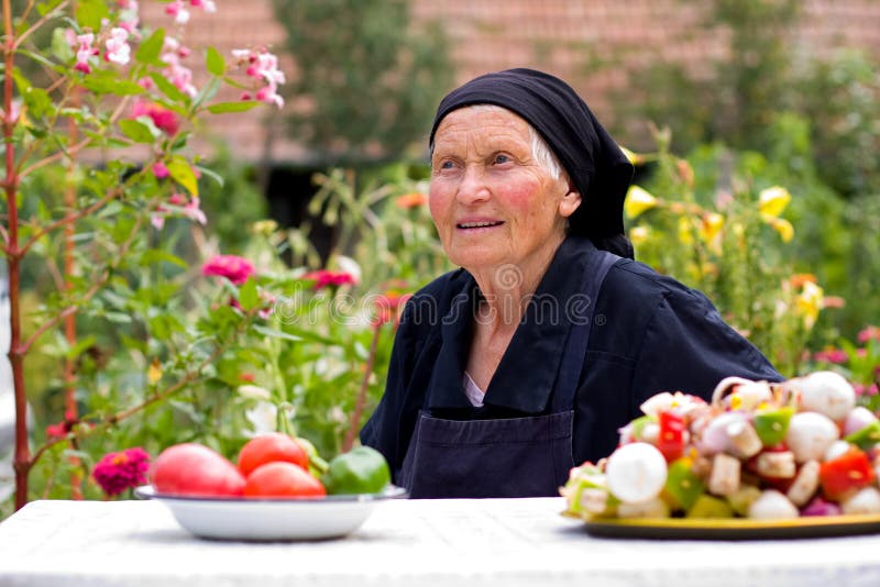 Elderly woman talking at the table