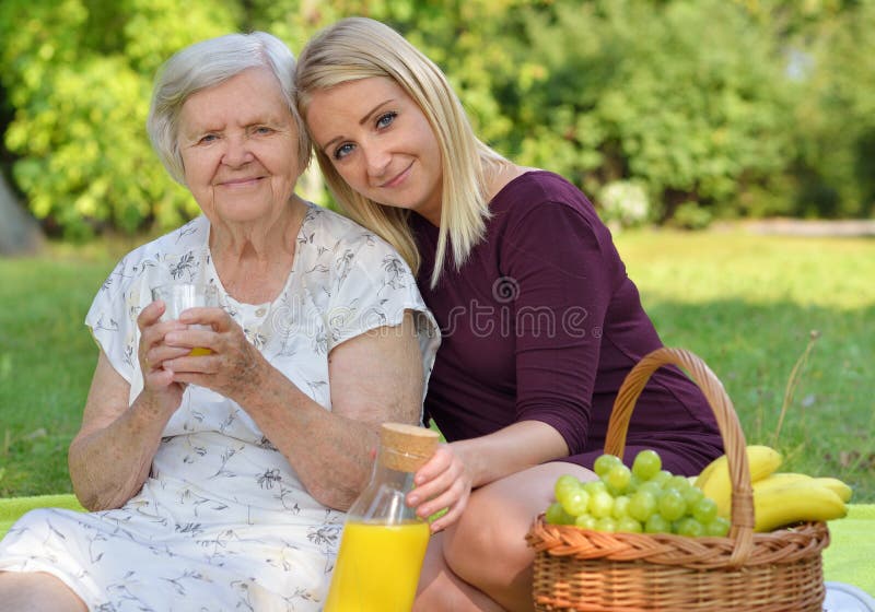 Elderly woman and young woman at the picnic. royalty free stock photos Elderly woman and young woman at the picnic. royalty free stock photos