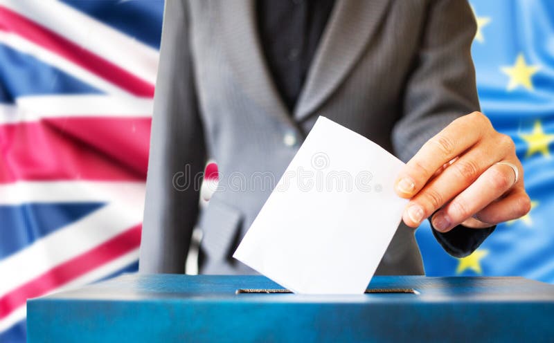 Elections in European Union. The hand of woman putting her vote in the ballot box. EU an UK flag in the background