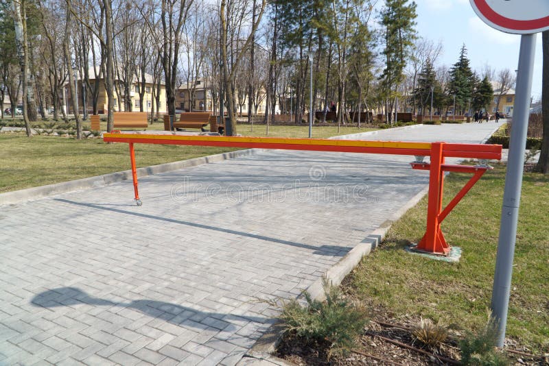 Electric Barrier and Speed Bumps at the Entrance To a Parking Lot Stock