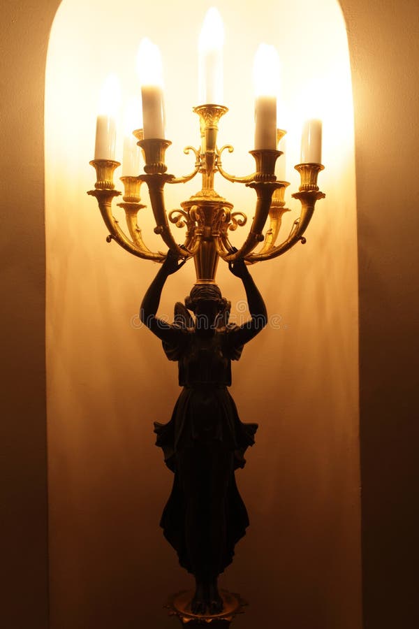 An Electric Candle Burning Under a Glass on Table Stock Photo Image