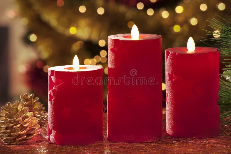 Electric Candles with Christmas Decorations in Atmospheric Light Stock