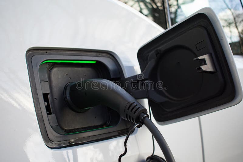 Electric Car Charger at Home Charger Plugged in with EV with Lights