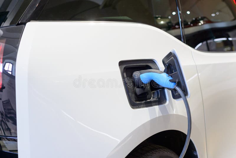 Electric car charging energy in station stock photography Electric car charging energy in station stock photography