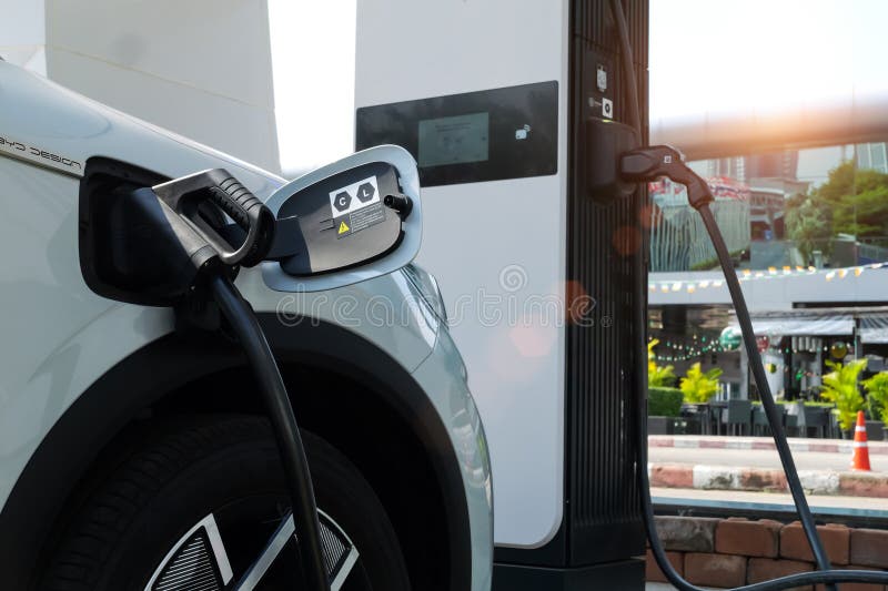 An Electric Car is Charging at an EV Charging Station. Stock Image