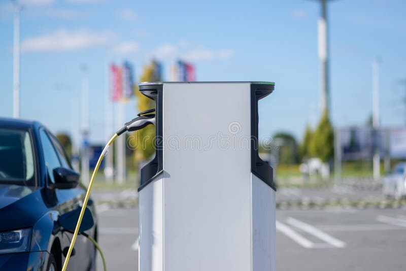 Electric Car Charging at a Station Stock Photo Image of europe