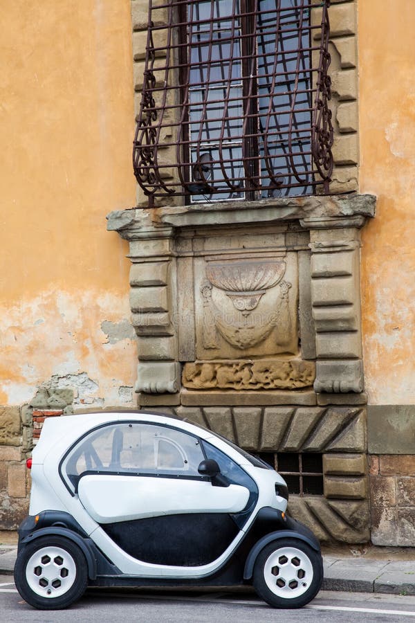 Electric Car Parked at the Beautiful Streets of Pisa Stock Photo