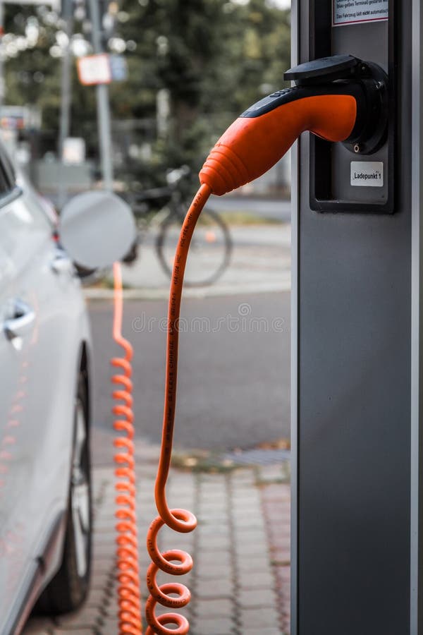 Electric car plug in editorial photo. Image of fuel 146281876