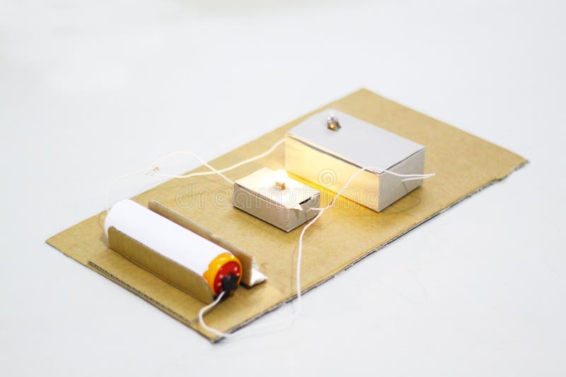 Create an electrical circuit series conducted in a cardboard box and a table. Create an electrical circuit series conducted in a cardboard box and a table