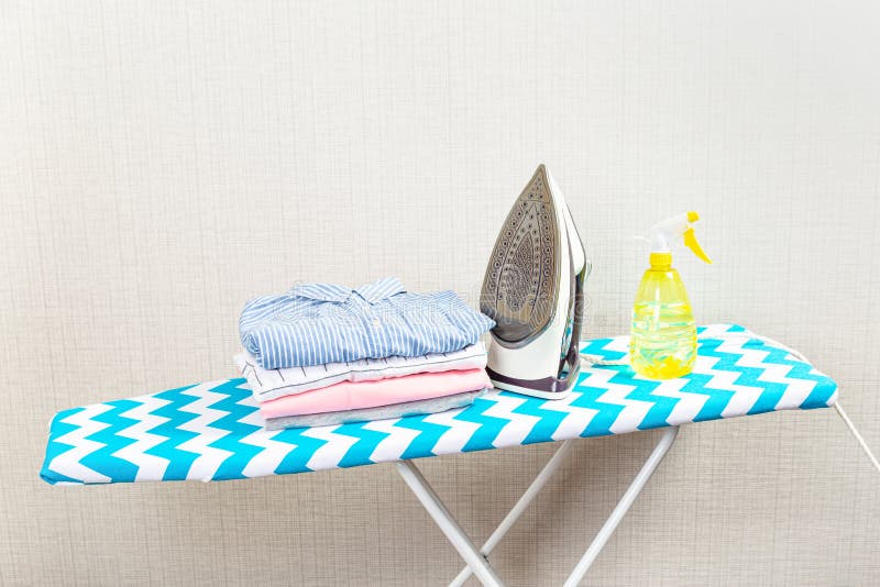 Electric Clothes Iron on the Ironing Board Stock Image Image of