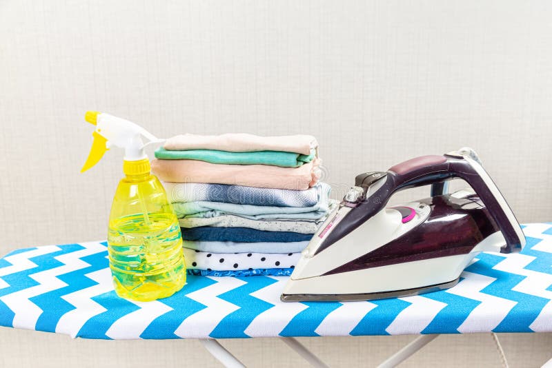 Electric Clothes Iron on the Ironing Board Stock Photo Image of