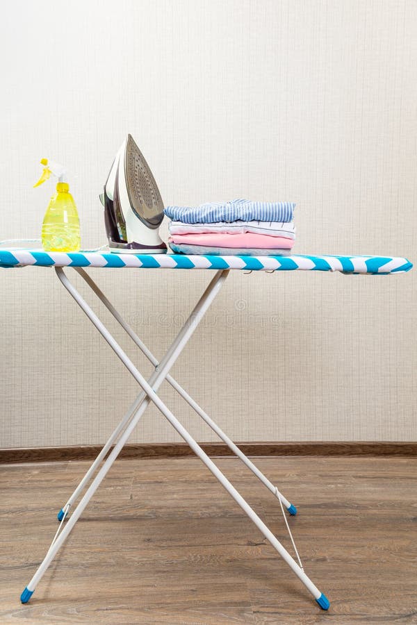 Electric Clothes Iron on the Ironing Board Stock Image Image of