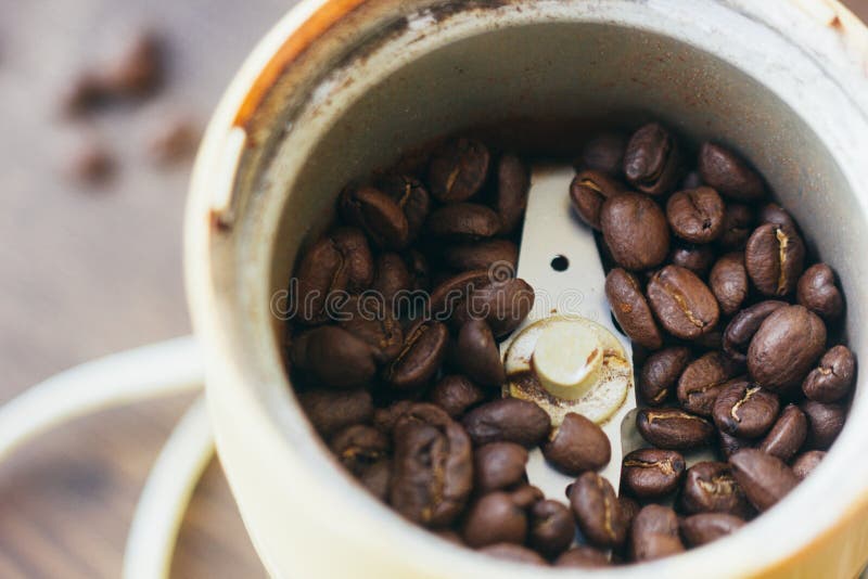 Electric Coffee Mill Machine with Coffee Beans Inside. Coffee Grinder