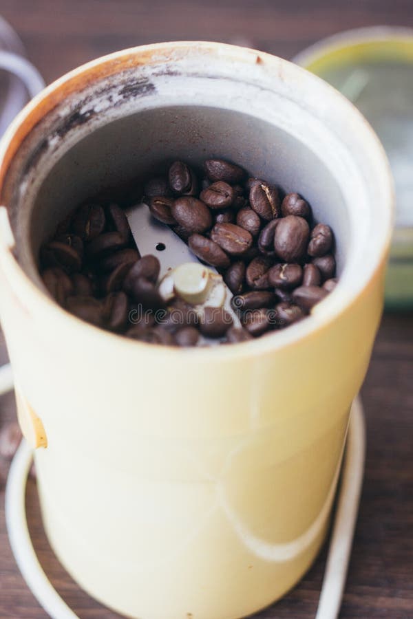 Electric Coffee Mill Machine with Coffee Beans Inside. Coffee Grinder