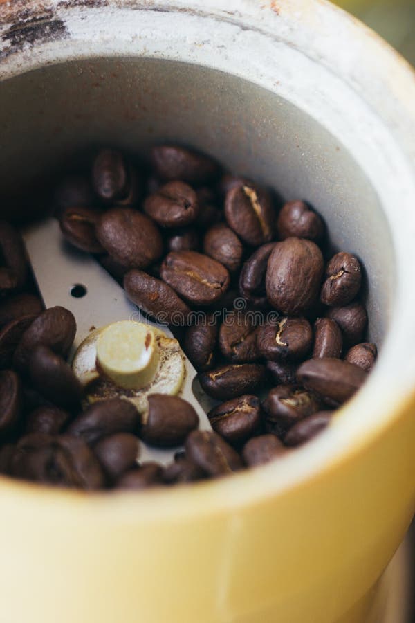 Electric Coffee Mill Machine with Coffee Beans Inside. Coffee Grinder