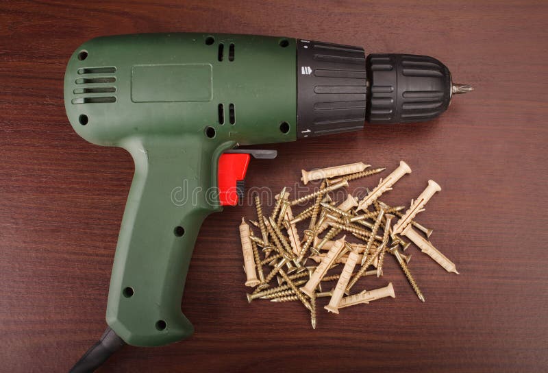 Electric drill and screws stock photo. Image of cordless 53108120