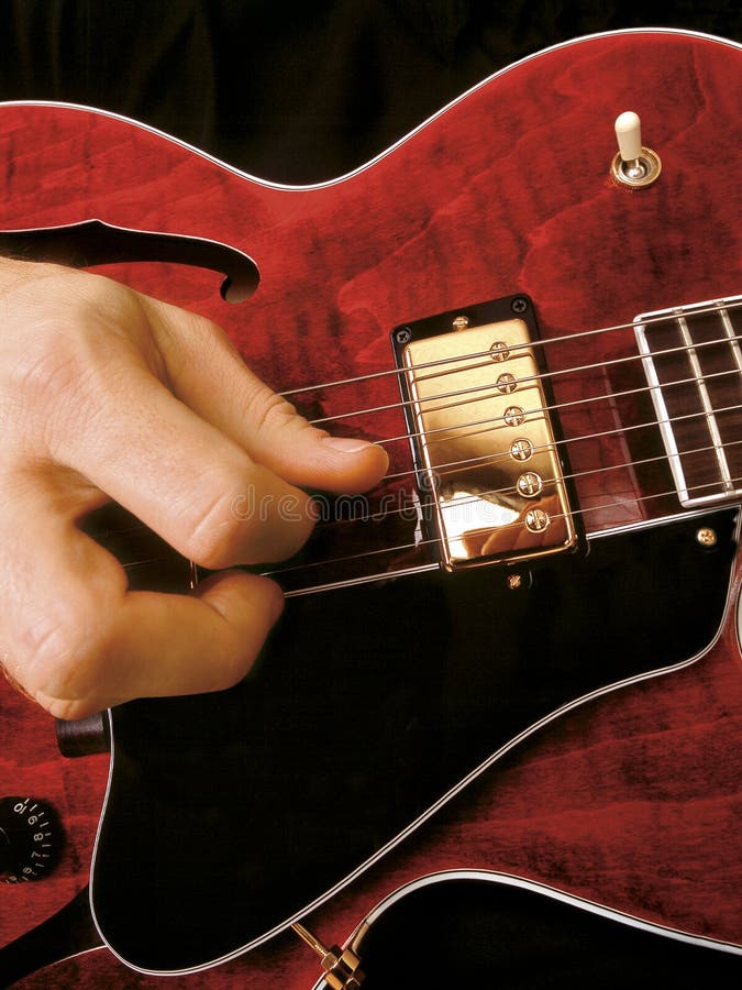 Electric guitar playing stock image. Image of metal, pick 560937