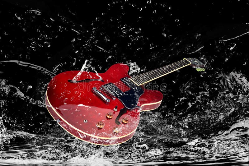 Electric guitar in water royalty free stock photography