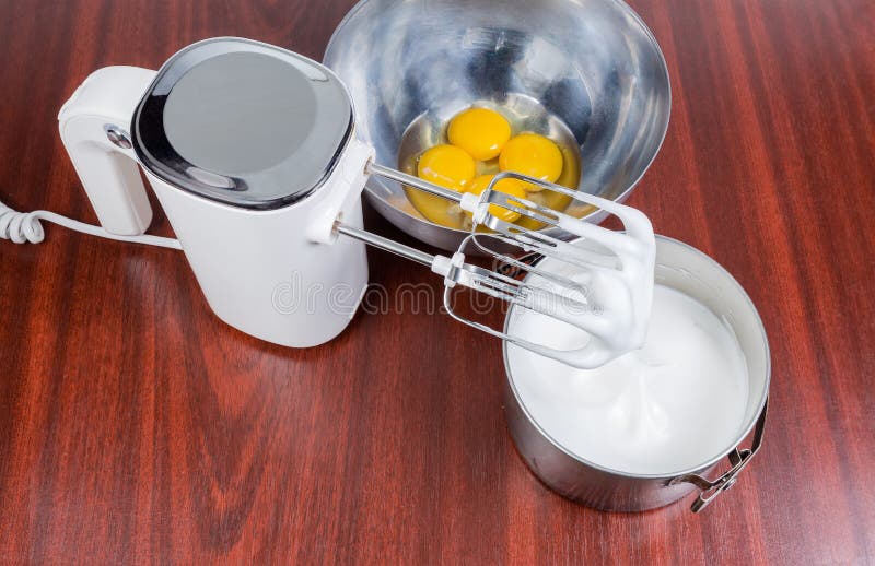 https://thumbs.dreamstime.com/b/electric-handheld-mixer-beaten-eggs-broken-bowl-white-hand-held-two-beaters-egg-whites-stainless-steel-wooden-131385253.jpg