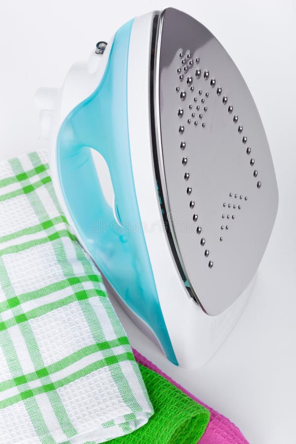 Electric iron and clothes stock photo. Image of organized 30030876