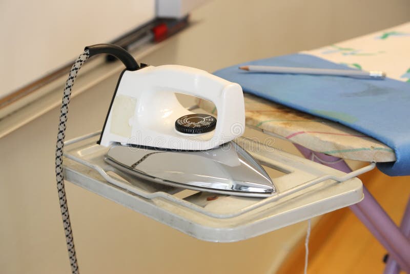 Electric Iron on Ironing Board Stock Image Image of ironing, electric