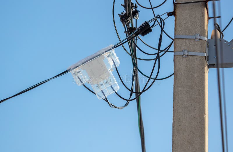 An Electric Meter on a Pole Against a Blue Sky Stock Photo Image of