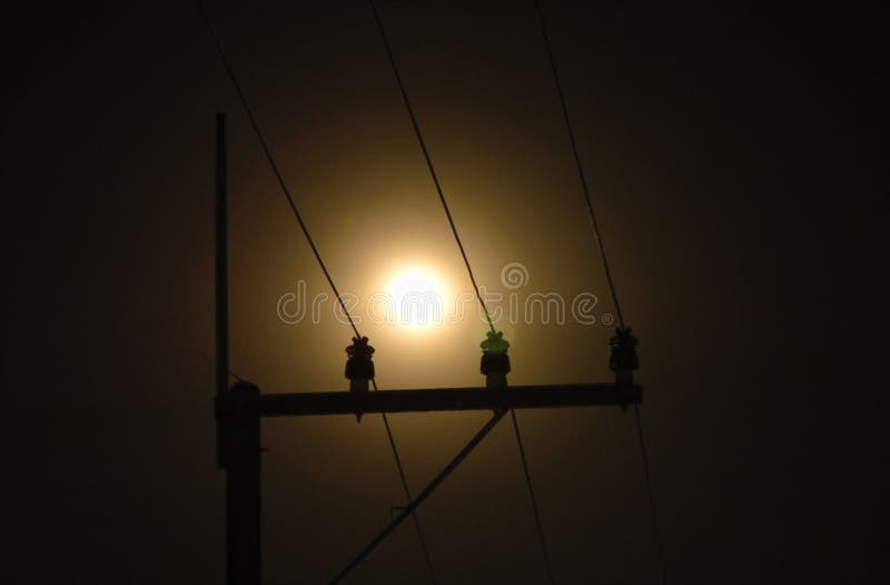 Electric pole and cable with full moon background in night royalty free stock photography Electric pole and cable with full moon background in night royalty free stock photography