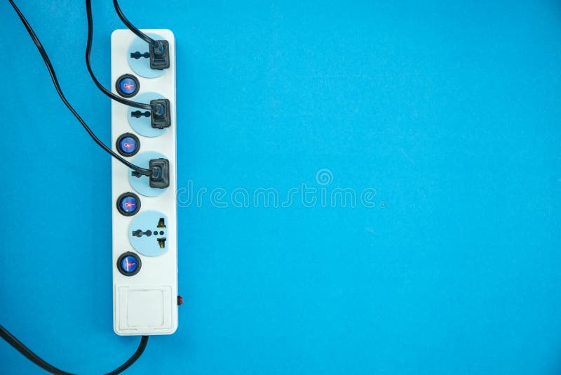 Electric Power Socket and Plug on Blue Paper Background Stock Photo