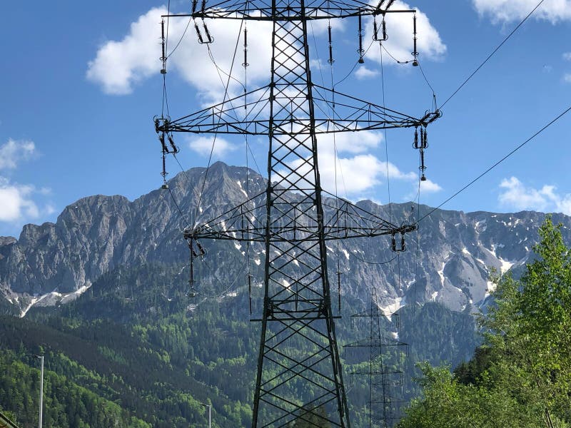 Electric Pylon with a Rocky Mountain Background. Stock Photo Image of