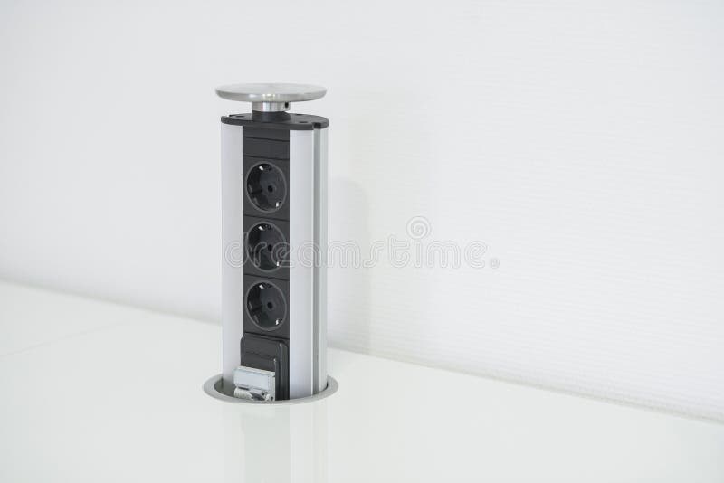 The Electric Socket is Built in the Kitchen Countertop. Stock Image