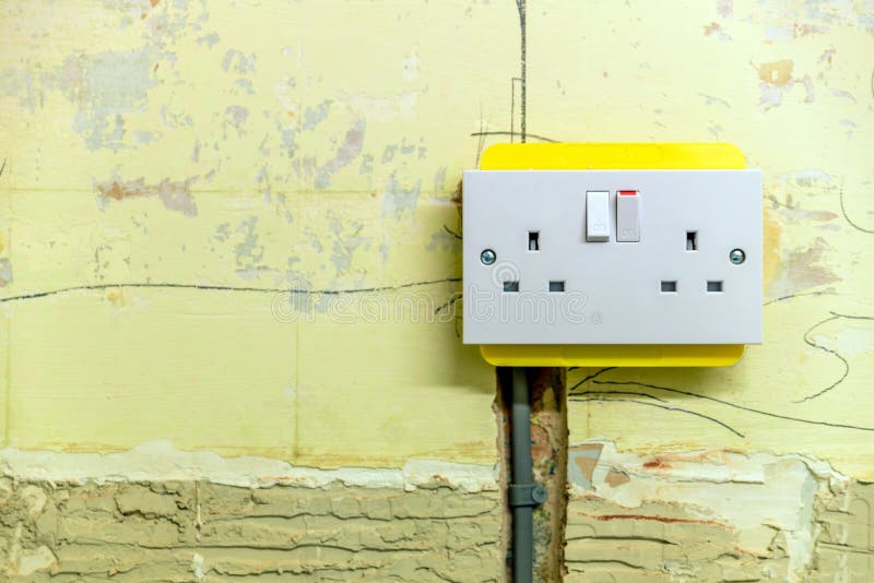 Electric Socket in a Wall during Renovation in England Uk Stock Image