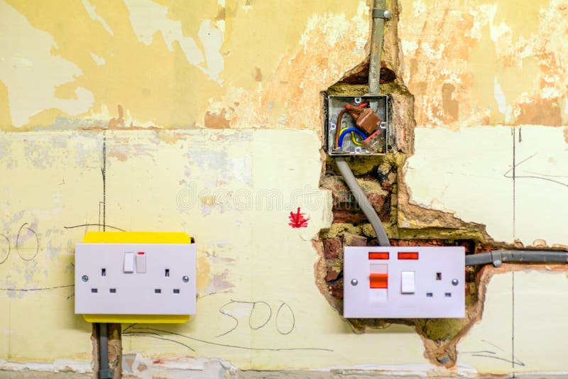 Electric Socket in a Wall during Renovation in England Uk Stock Image