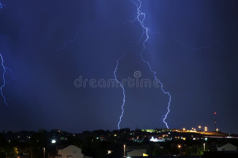 Electric Storm Above the City. Night Stormy Sky. Severe Weather Photo Collection.