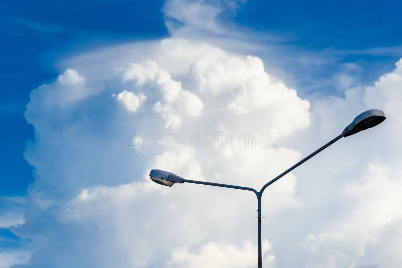 Electric Street Light Pole on Blue Vivid Sky in Day Light. Stock Photo