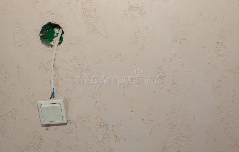 An Electric Switch Hangs on a Wire on the Wall Stock Image Image of