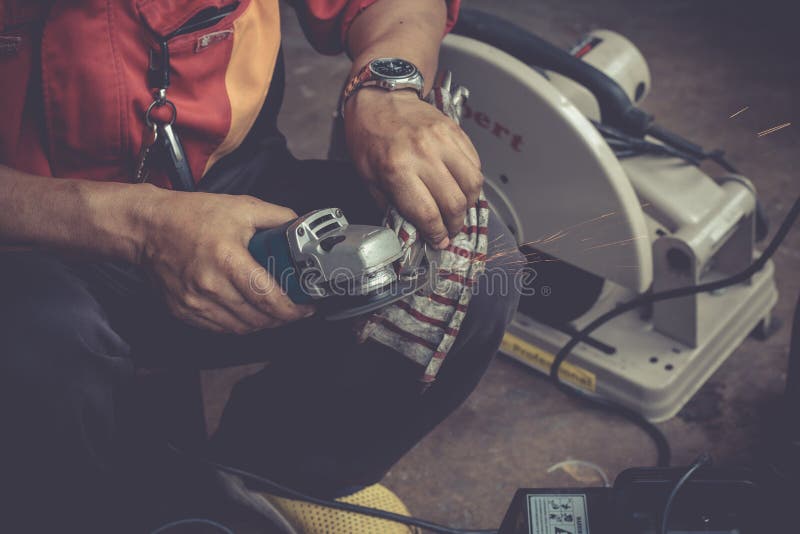 Electric tool wheel grinding machine with sparks stock photography