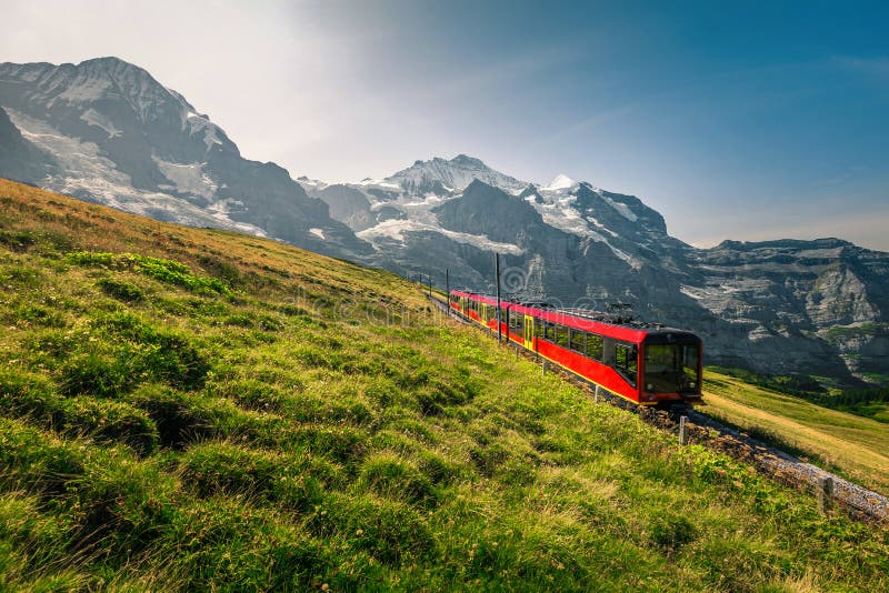 Electric Tourist Train and Snowy Jungfrau Mountains in Background, Switzerland Stock Photo - Image of glacier, cable: 163607274 Electric Tourist Train and Snowy Jungfrau Mountains in Background, Switzerland Stock Photo - Image of glacier, cable: 163607274