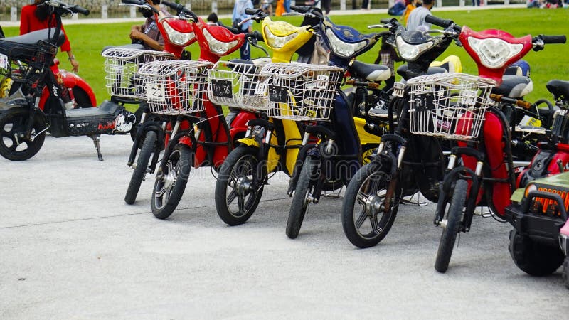 Electric Toy Vehicles And Bicycles Aligned In A Line For ...
