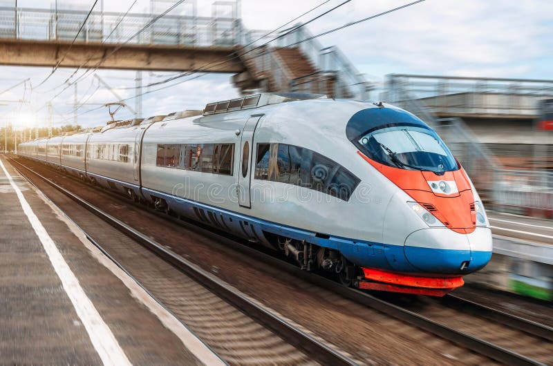 The Electric Train Drives at High Speed at the Station. Stock Photo