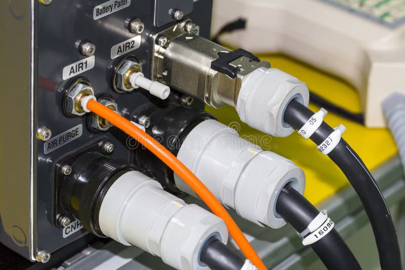 Electric wire and air hose connected at control box for robot arm welding.