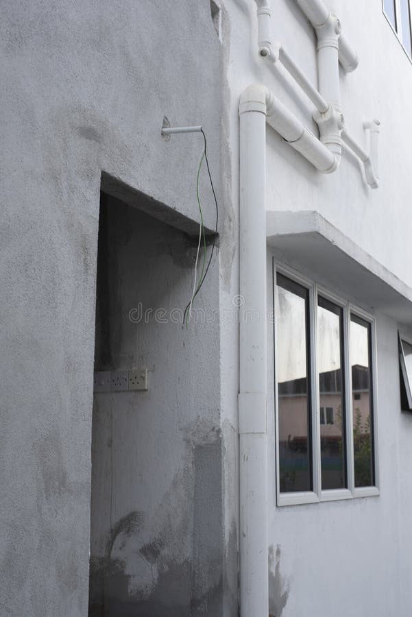 3 Electric Wires Laying Out from the Concrete Wall Stock Photo Image