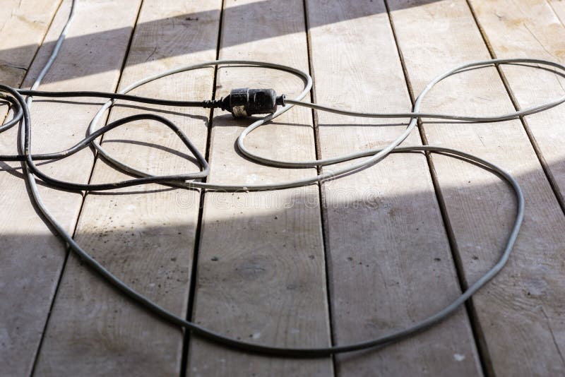 Electrical Cable Extension Plug in Construction Site on the Wood Stock
