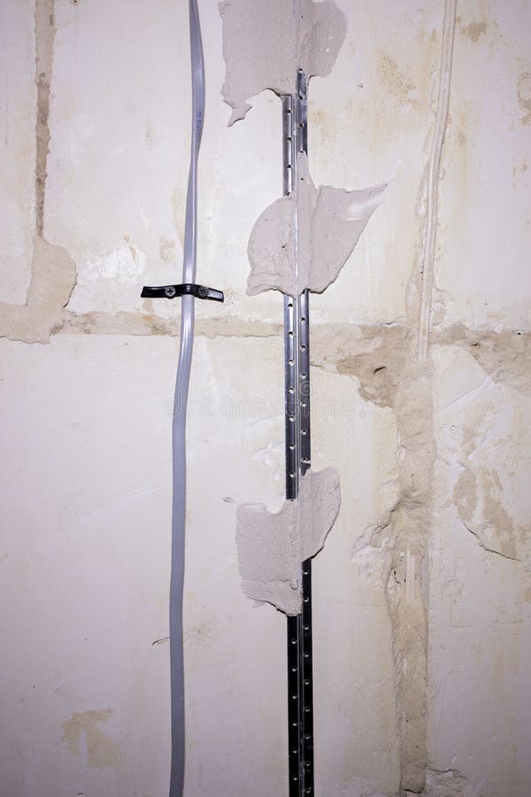 Electrical Cable Laying on Wall. Wiring Replacement. Connecting Light