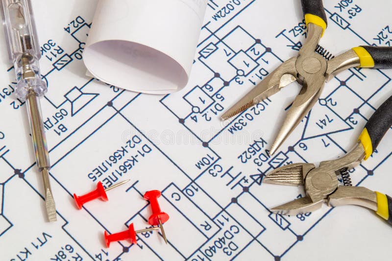 Electrical Diagrams and Metal Pincers Building a House Concept for