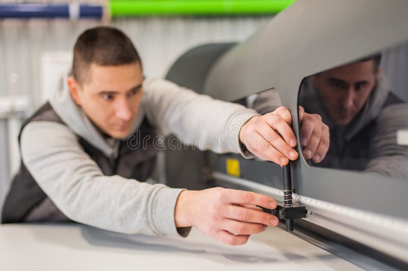 Electrical Engineer Operator Repairs Large Industrial Printer and