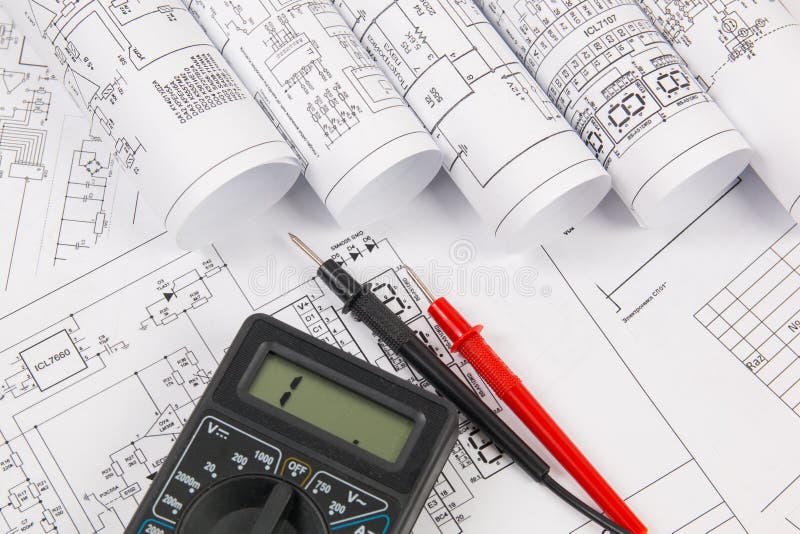 Electrical engineering drawings and digital multimeter royalty free stock photo Electrical engineering drawings and digital multimeter royalty free stock photo