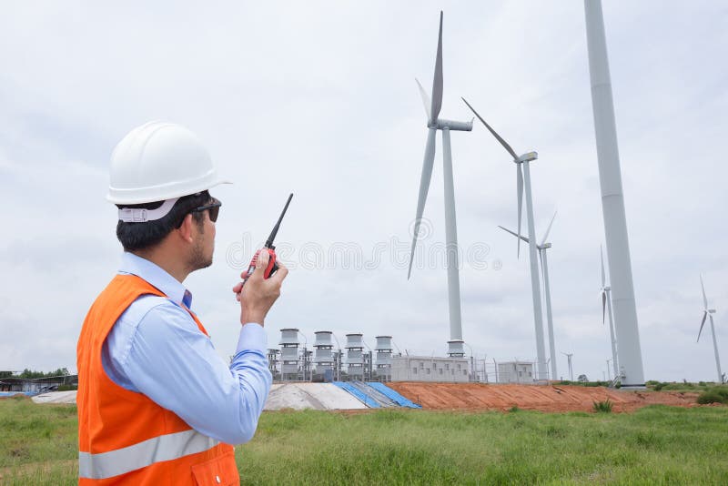 Electrical engineers working at wind turbine power generator stock image