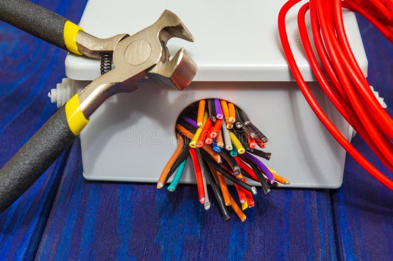Electrical Junction Boxes with Cable Wires and Tool Usually Used in the Electric Installation