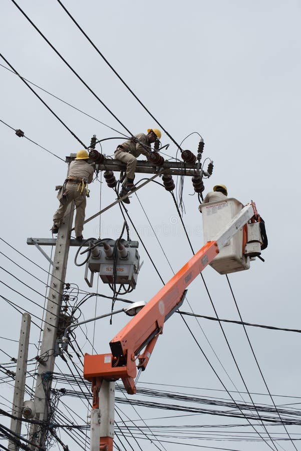 An Electrical Lineman Working on a Line Editorial Photo Image of